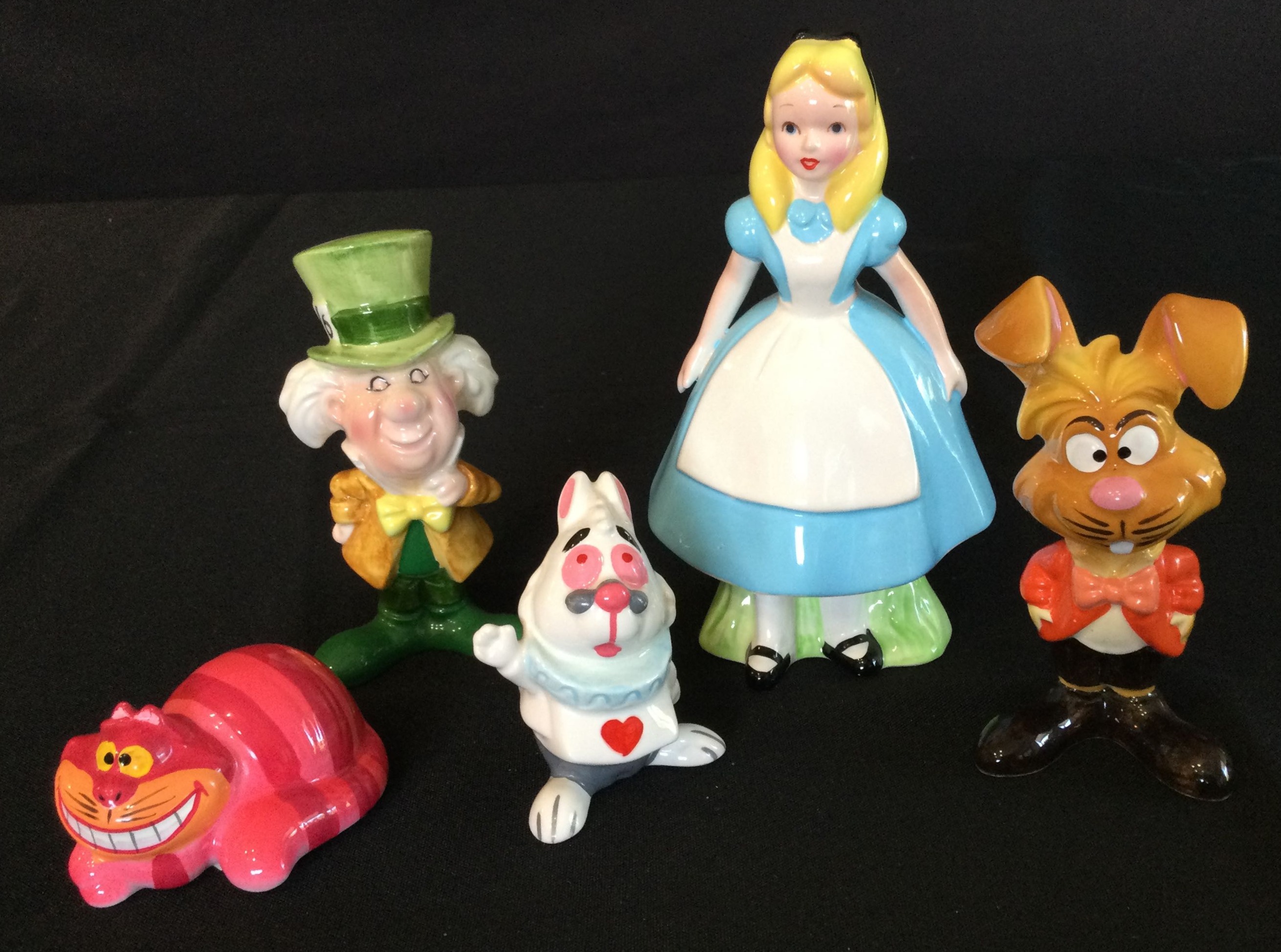 At Auction: A group of over 20 Alice in Wonderland assorted collectible