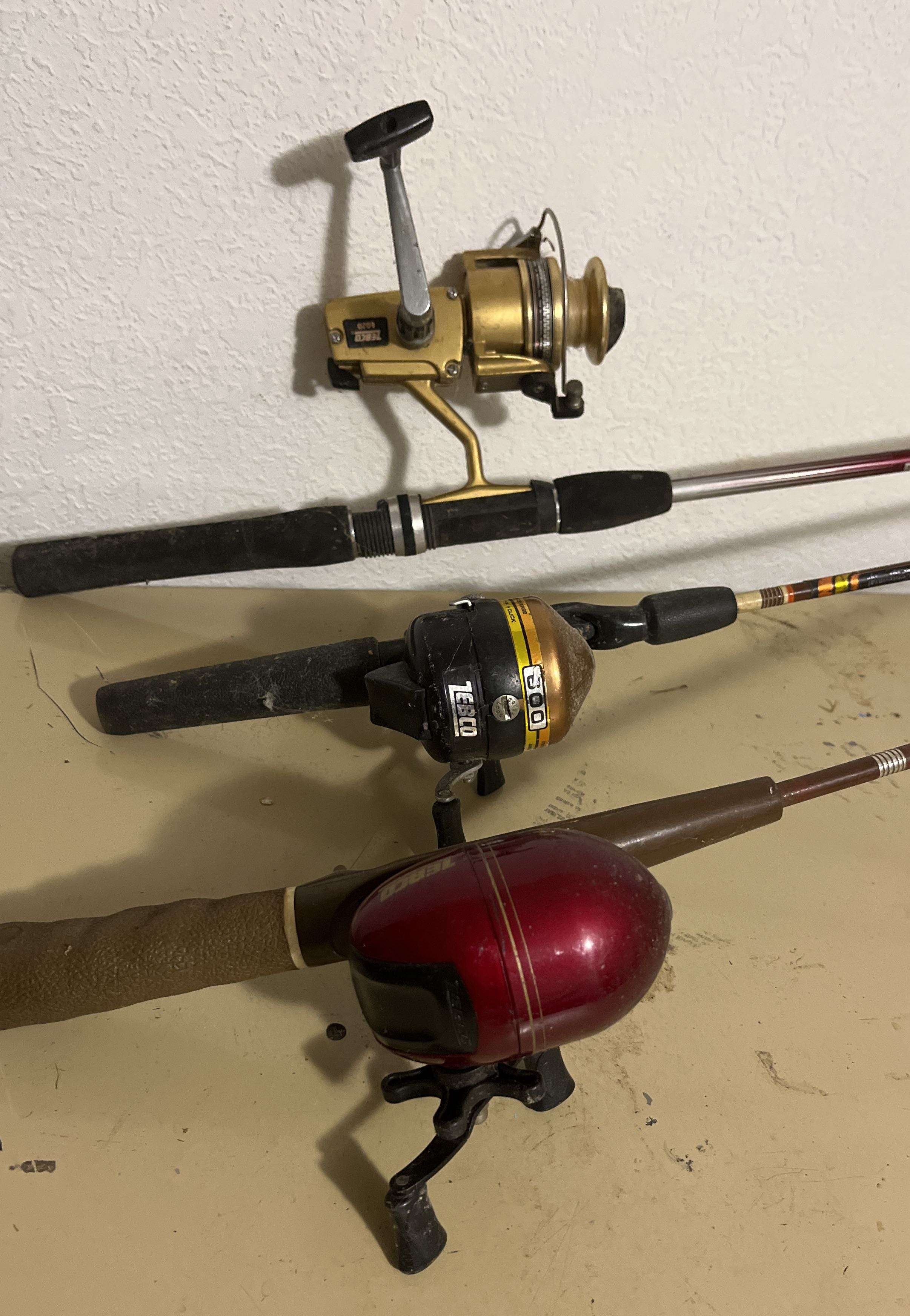 Sold at Auction: Three Vintage Fishing Rods and Reels