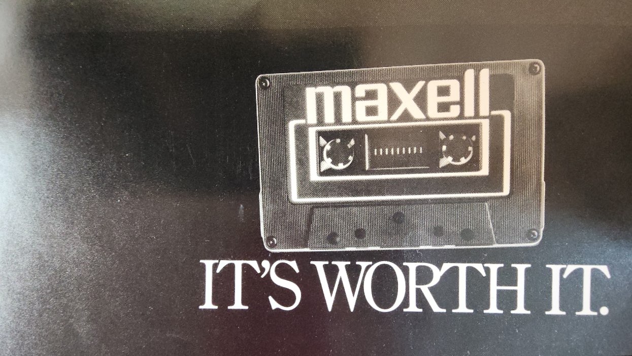 Advertisement-Poster-for-Maxell-Cassette-Tapes-Featuring-a-Porsche
